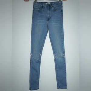 Forever 21 Light-wash high waist ripped skinny jeans. Size 25.